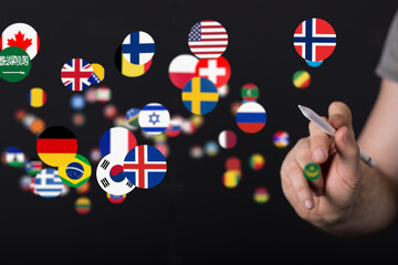 Fototapete - Image of a hand selecting various country flags. Ideal for global business, communication, and travel concepts.