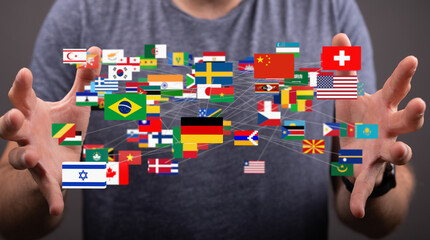 Fototapete - Image of hands holding a network of interconnected flags representing global connections.