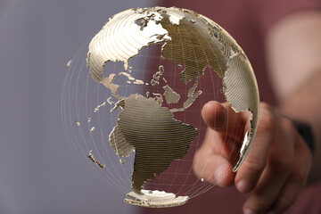 Poster - person's finger touching a holographic earth globe, symbolizing global reach and connection.