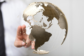 Fototapete - Hand interacting with a digital globe, symbolizing global network and business connections.