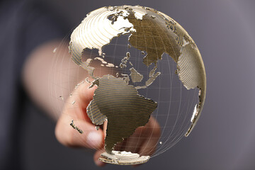 Fototapete - High-quality stock photo of a hand interacting with a 3D holographic earth globe, representing global connectivity and networking.