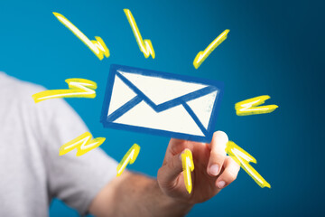 Fototapete - Image of a hand interacting with a digital email icon, surrounded by bright yellow strokes. Perfect for communication, technology, and digital marketing co