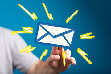 Leinwandbilder - Hand holding email icon, signifying online communication and message receiving.