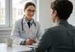 © Laki - Female doctor consulting with patient in office setting at desk