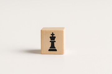 Poster - This minimalist wooden block featuring a chess piece symbolizes leadership and strategic decision-making essential for business growth and success