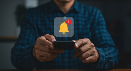 Notification Alert: A man in his 30s checks his smartphone, displaying a clear notification of a single alert, signifying a new message or update.