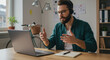 © Aekion - Man in his 30s conducts an indoor online video call wearing a headset, casually dressed at his home office.
