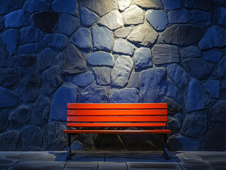 Poster - Red Bench Against Stone Wall with Dramatic Lighting Creates Urban Scene