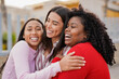 © Sabrina - Group of happy diverse latin women having fun hugging each other outdoor - Travel, vacation and friendship concept