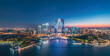© zhao dongfang - Striking aerial night view of a modern city skyline with distinctive architecture and illuminated waterfront in Suzhou, China. Urban business background.