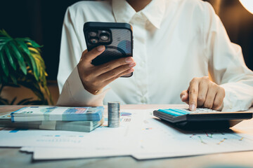 Poster - Business concept. Business Professional Using Smartphone and Calculator in Financial Analysis at Modern Workspace