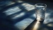 © affandy - Glass of water illuminated by sunlight