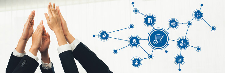 Poster - A dynamic image illustrating teamwork and collaboration, showcasing hands raised together amid technology icons, symbolizing innovation and connectivity in the business world. Amity