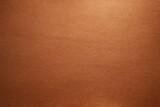 Luxurious textured background of shiny, grainy matte copper foil, exhibiting a subtly sanded or brushed metal finish with warm, reflective metallic tones.