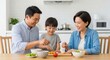 © AlfaSmart - Happy family dining together in modern kitchen