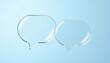 © pray_darling - Two glass transparent speech bubbles floating on a light blue background