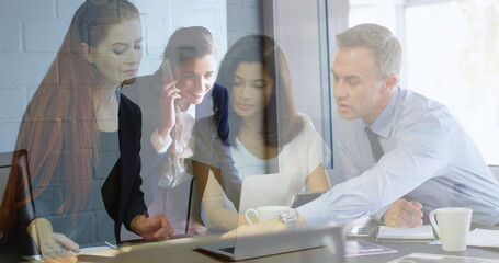 Poster - Image of caucasian businesswoman having call over diverse businesspeople working in office