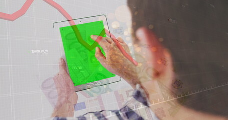 Poster - Red graph and sparks of light over caucasian man using digital tablet with copy space