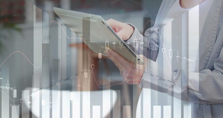 Poster - Image of graphs over hands of caucasian woman using tablet in office