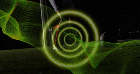 Poster - Image of spiral light trail against mid section of male soccer player practicing soccer