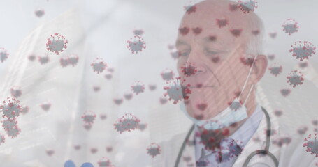 Poster - Image of virus cells over caucasian male doctor wearing gloves