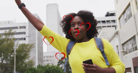 Poster - Image of red hearts over african american woman using smartphone