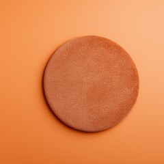 Poster - Smooth circular object with a warm terracotta texture on a soft orange background, ideal for creative projects