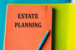 © Zhanna - ESTATE PLANNING - words on an orange notepad on a background of multi-colored folders