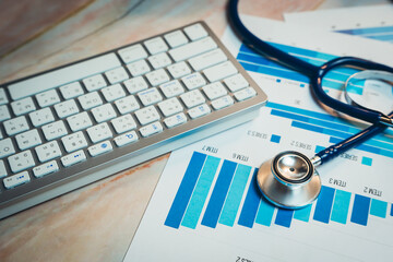 Poster - health care concept. medical data analysis with stethoscope and keyboard on colorful graphs and char