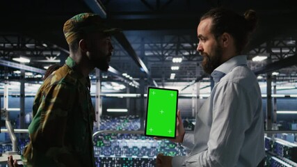 Poster - Military personnel overseeing AI computing operations on isolated screen tablet in high tech server facility. Army tech experts using chroma key device to oversee communication systems, camera A