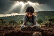 © Akhmad Masudi - Child Planting a Tree Under Dramatic Sky