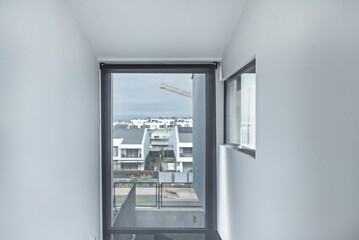 Poster - rooms that incorporate large aluminum windows and balcony access represent a modern and desirable vision of the home