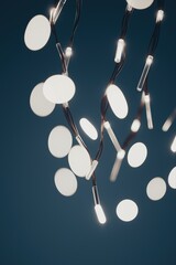 Poster - A string of white lights with a blue background. The lights are arranged in a spiral pattern. The lights are lit up and create a warm, inviting atmosphere