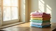 © Leonardo - Camisas de cuello redondo sin mangas apiladas en colores surtidos, colocadas sobre una mesa cerca de una ventana grande con luz solar natural