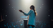 © Gorodenkoff - Beautiful Personal Growth Keynote Speaker Delivering a Motivational Speech on Stage, Hosting a Healthcare Seminar to Help Entrepreneurs Overcome Their Personal and Professional Challenges