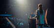 © Gorodenkoff - Anonymous Female Speaker Talking to the Audience as She Goes on Conference Stage. Businesswoman Standing with Her Back to Camera, Wearing a Suit, Speaking at an International Business Meeting
