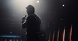 © Gorodenkoff - Startup Founder Walking Out on Stage to Give a Talk at a Global Business Summit. Audience Ready to Listen to His Talk. Speaker Standing with His Back to Camera While Making a Motivational Speech
