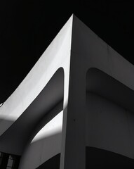 Poster - Geometric architectural elements showcase the interplay of light and shadow. The minimalist design is accentuated by the stark contrast between light and dark.