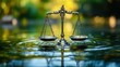 © RONNY - Justice scales on rippling water