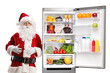 © Ljupco Smokovski - Santa claus leaning on a fridge full of food