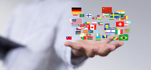 Poster - Image of a hand holding various flags, symbolizing global connection and international relations.