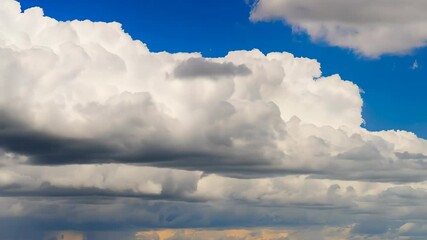 Poster - Dramatic cumulus cloudscape against a vibrant blue sky.