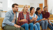 © Monkey Business - Group Of Young Friends Watching Sports On Television And Cheering