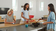 © Monkey Business - Group Of Multi Cultural Female Friends Preparing Meal Together In Modern Kitchen