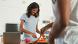 © Monkey Business - Young Couple Preparing Meal Together In Modern Kitchen