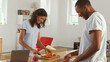 © Monkey Business - Young Couple Preparing Meal Together In Modern Kitchen