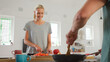 © Monkey Business - Close Up Of Young Couple Preparing Meal Together In Modern Kitchen