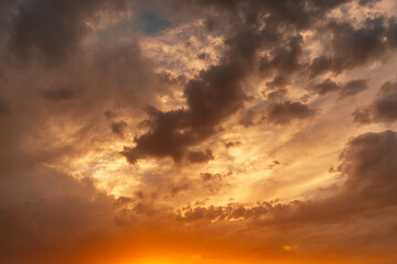 Wall Mural - Beautiful bright sunset evening sky with dramatic clouds.