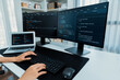© InfiniteFlow - Cropped hands image of IT developer creating with typing information on pc with coding program information data website application, wearing jeans shirt surround safety analysis two screen. Stratagem.