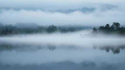 Wall Mural - Serene landscape with fog over calm lake at dawn  